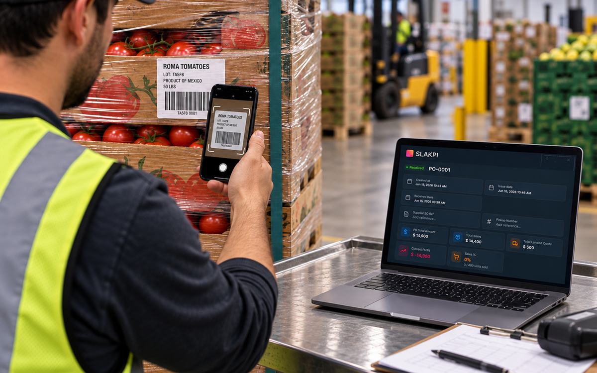Warehouse worker scanning a Roma tomatoes pallet while using SLAKPI on a laptop